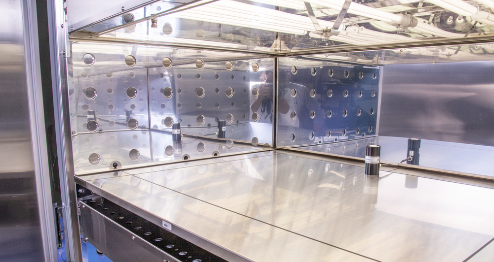 Photo of the interior of a stability testing chamber, showing its stainless-steel finish and lighting.